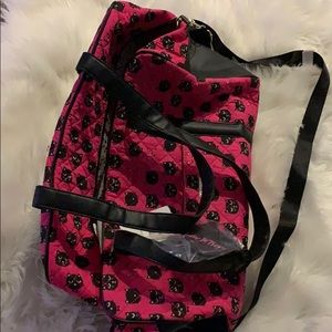 Pink duffle bag with cats